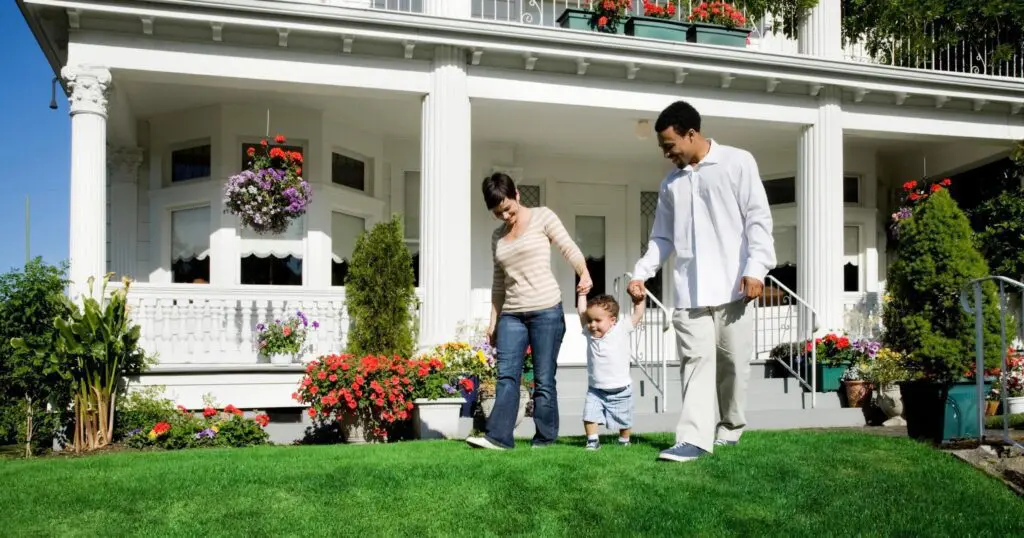 Happy family in a healthy front yard